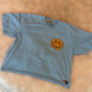 Aviator Nation Blue T-Shirt with Smiley Face “Never Stop Chasing Rainbows”